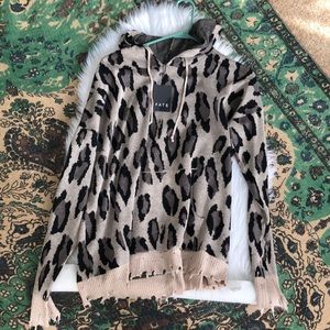 Distressed knitted sweater